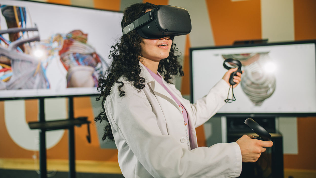 This image is showing the ICM student learning VR Technology 